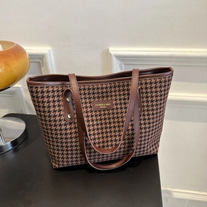 Retro houndstooth tote bag with brown leather trim and metal rivets for daily commuting