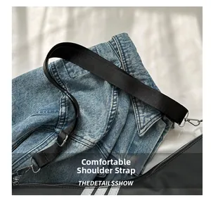 Close-up of adjustable wide nylon shoulder strap with silver metal swivel hooks