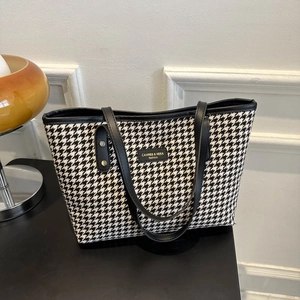 Classic houndstooth tote bag with black leather trim for elegant office and daily commuting
