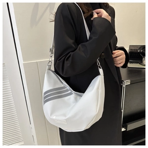 Close-up of white nylon half-moon crossbody bag with grey stripes and Fashion label