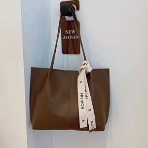 Brown soft leather tote bag with vertical stitching and fashion strap for women