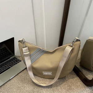 Chic khaki nylon crescent crossbody bag with adjustable wide strap and fashion label