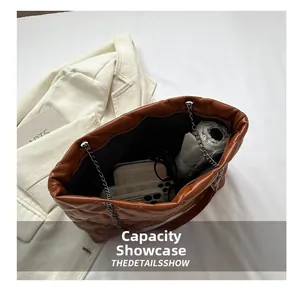 Top view of large capacity quilted tote bag showing daily essentials interior storage