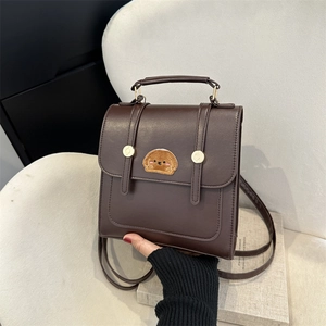 Minimalist dark brown PU leather backpack with cute dog embroidery and top handle
