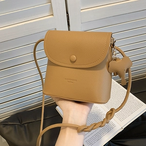 Classic camel faux leather crossbody bag with pebble texture and cute elephant pendant