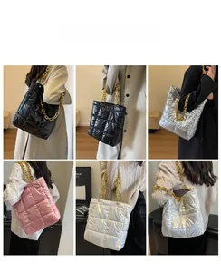Quilted nylon bucket bag with chunky gold chain strap shown in four versatile colors