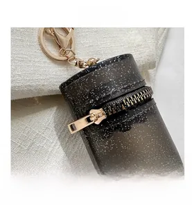 Macro shot of mini black glitter bag featuring high-quality gold zipper and lobster clasp