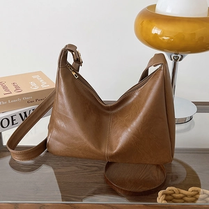 Retro dark brown PU leather underarm bag with zipper closure and vintage texture
