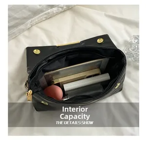 Internal view showing large capacity for tablet and essentials in black quilted bag