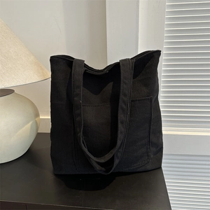Large capacity black corduroy tote bag with front pocket and soft ribbed texture design