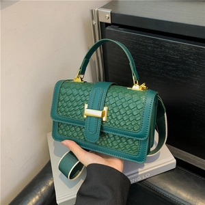 Green woven leather handbag with gold H-buckle and colorful wide canvas shoulder strap