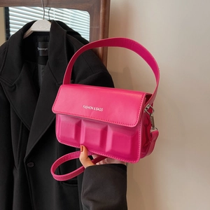 Elegant magenta textured small square handbag with silver lettering and crossbody strap