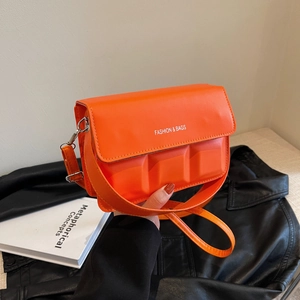 Vibrant orange crossbody square bag with embossed design and fashion print