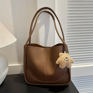 Vintage dark brown large tote bag with U-shaped stitching and cute plush bear charm