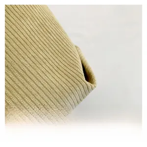Macro close-up showing the soft ribbed texture of premium khaki corduroy fabric detail