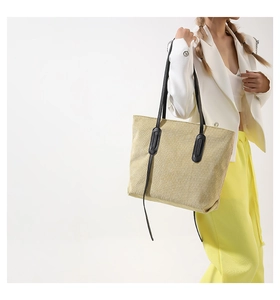Detailed texture of beige vertical striped tote bag showing fine corduroy material