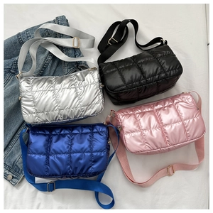 Quilted puffer bags in silver, black, blue, and pink with adjustable shoulder straps