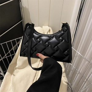 Minimalist black woven faux leather underarm shoulder bag with solid color finish