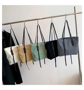 Detailed corduroy texture and color variety of large capacity tote bags in a row