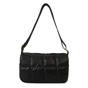 Glossy black quilted puffy crossbody bag with adjustable strap and top zipper closure