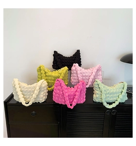 Detailed view of bubble texture pleated shoulder bags in six vibrant trendy colors