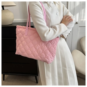 Pink quilted tote bag detail with large capacity and soft puffy cloud texture design