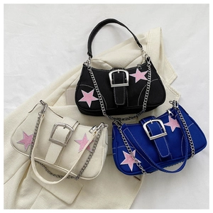Detailed view of canvas star bags in black, beige, and royal blue with chain straps