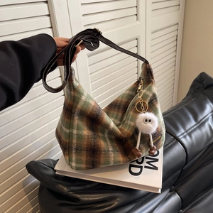 Retro plaid hobo bag in green and brown wool with a cute plush charm and leather strap