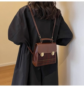 Vintage plaid briefcase bag worn as a backpack, showing proportions on a female model