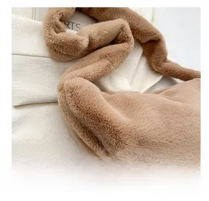 Detailed side view of fuzzy plush dumpling bag showing the soft faux fur texture