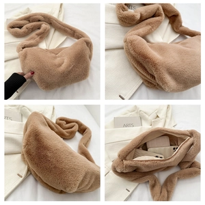 Detail view of brown plush faux fur crossbody bag showing spacious interior and soft texture