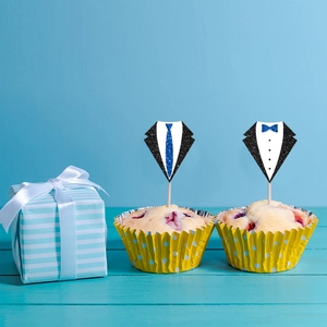 Detail of glitter tuxedo and blue tie cupcake toppers for Father's Day party decorations