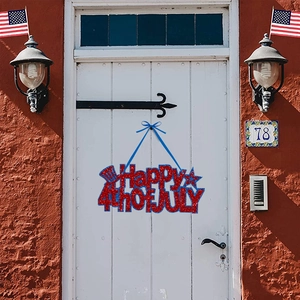 Glittery Happy 4th of July hanging sign on a white wooden door for Independence Day decor