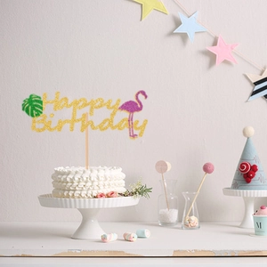 Sparkling Happy Birthday cake topper with pink flamingo and green palm leaf decorations