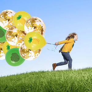 Hawaiian party balloon set with pineapple leaf prints and gold confetti for birthdays