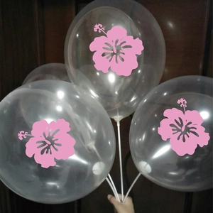 Detail of transparent balloons with pink hibiscus flowers and white support sticks