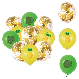 Close-up of tropical party balloons with monstera leaves, pineapples, and gold confetti