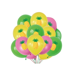Detail of tropical party latex balloons with yellow pineapple print in bright colors