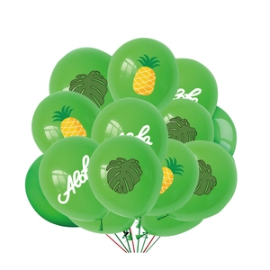 Detail of green tropical balloons featuring pineapple, palm leaves and Aloha text