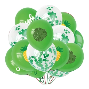 Close-up of Aloha tropical party balloons with green leaves and pineapple prints