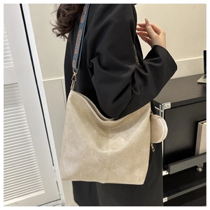 Beige oversized tote bag with bohemian ethnic strap and round coin purse detail