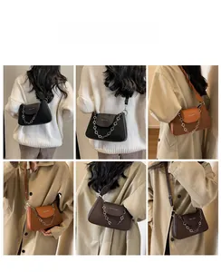 Collage of leather crossbody bag in black and caramel with floral chain detail