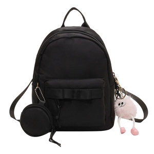 Mini black nylon backpack for women with bow decoration and pink plush monster pendant