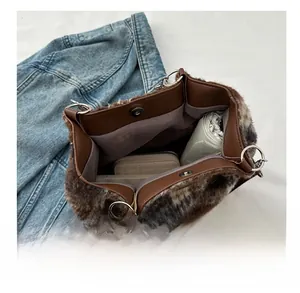 Macro view showing large capacity of the leopard plush tote bag with secure magnetic closure