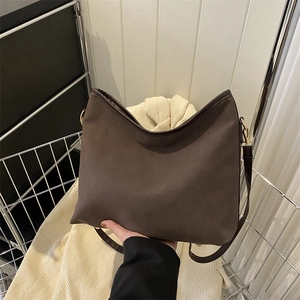 Retro dark brown hobo bag with matte texture and gold hardware for daily commute