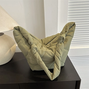 Quilted heart-pattern hobo bag in sage green with knot handle and zip closure
