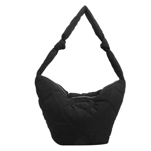 Large black heart-quilted shoulder bag with knot strap detail and water-resistant fabric