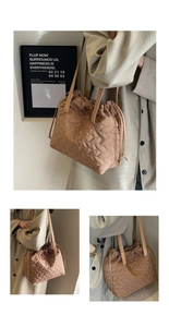 Close-up of brown quilted shoulder bag featuring wavy stitching and drawstring closure