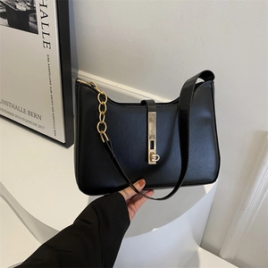 Minimalist black leather underarm bag with gold chain and metal buckle for women