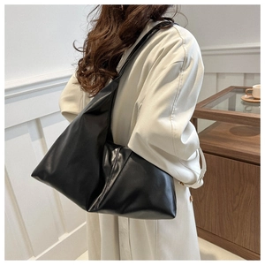 Detail view of large black soft PU leather hobo shoulder bag with a wide strap